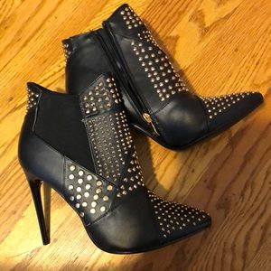 Black booties 4” Stiletto heels. Never been born